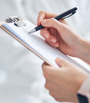 A doctor taking notes